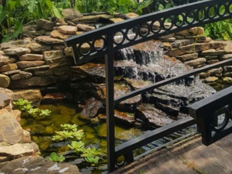 A landscape bridge is a great way to tie in water in your garden or landscape.