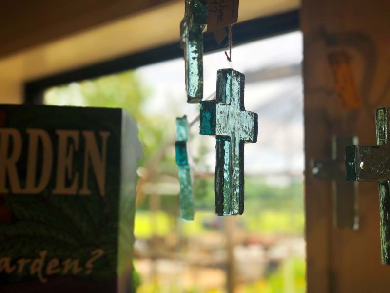 An ornametal handmade glass cross wind chime make great gifts for the gardener.